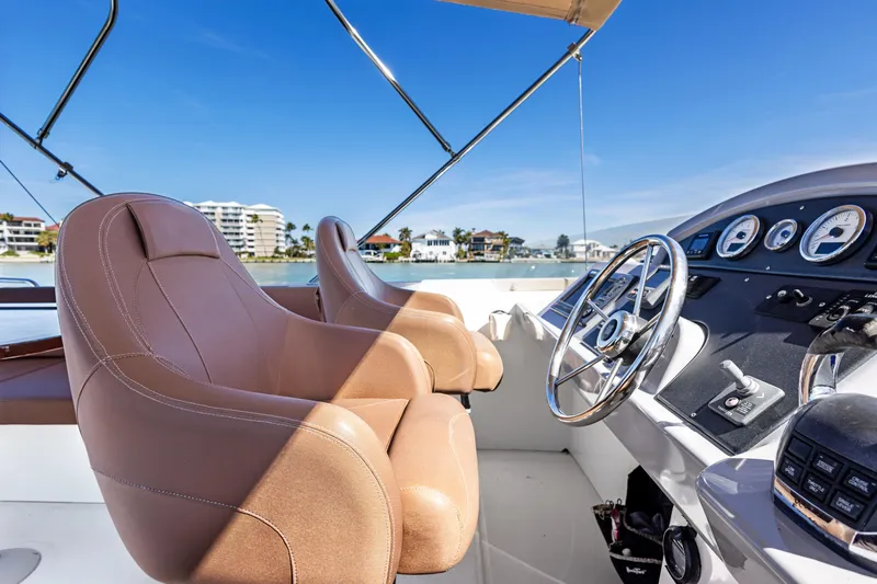 Lady Di Yacht Photos Pics Helm of 2012 Beneteau Swift Trawler 44 with leather seats and modern controls.