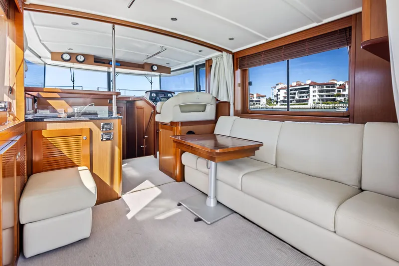 Lady Di Yacht Photos Pics Interior of 2012 Beneteau Swift Trawler 44 with modern furnishings and panoramic windows.