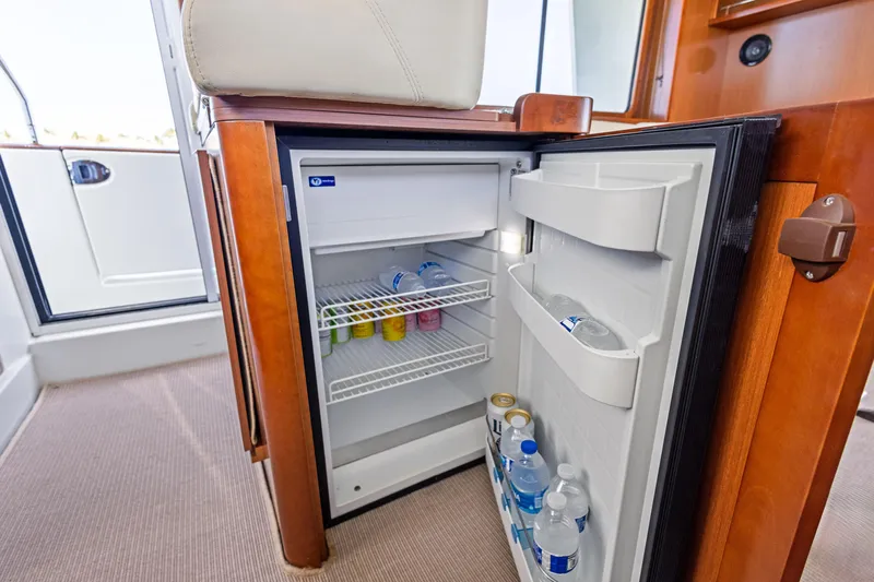 Lady Di Yacht Photos Pics Mini fridge stocked with drinks inside a 2012 Beneteau Swift Trawler 44 yacht.