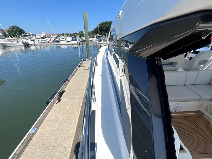 Vamanos Yacht Photos Pics 2023 Beneteau Gran Turismo 41 yacht docked at marina, sunny day.