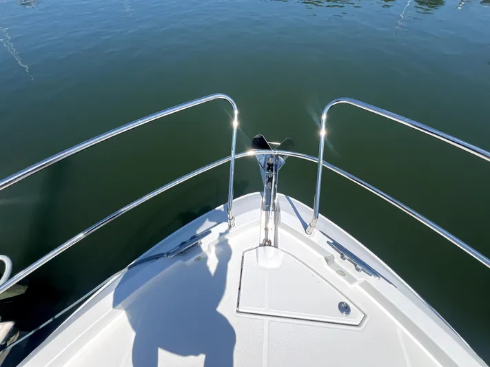 Vamanos Yacht Photos Pics Bow of 2023 Beneteau Gran Turismo 41 yacht on calm water.