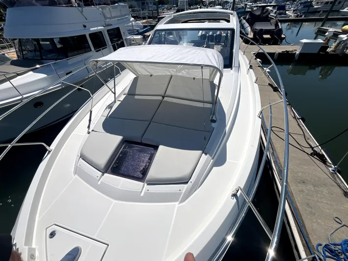 Vamanos Yacht Photos Pics 2023 Beneteau Gran Turismo 41 yacht with sunshade, docked at marina.