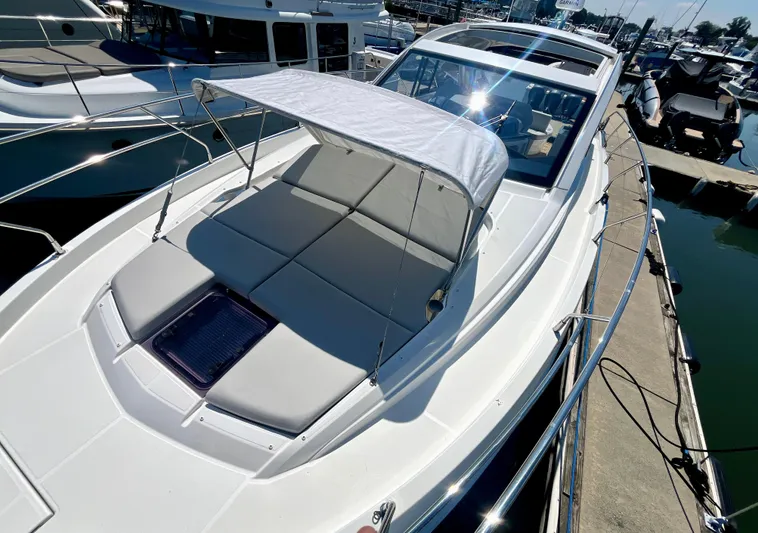 Vamanos Yacht Photos Pics 2023 Beneteau Gran Turismo 41 yacht with sunshade, docked at marina.