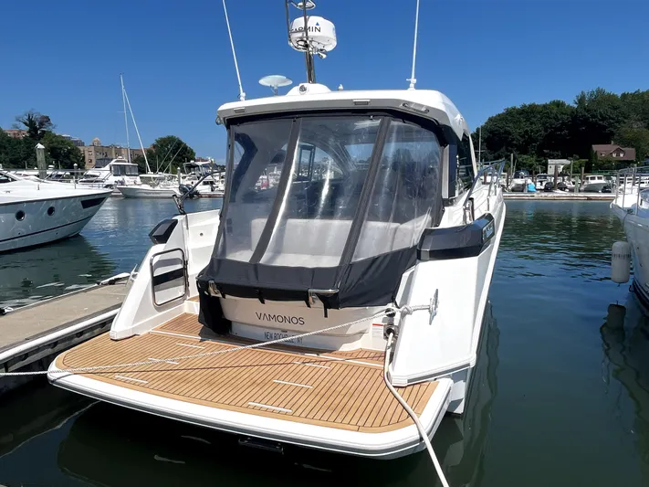 Vamanos Yacht Photos Pics 2023 Beneteau Gran Turismo 41 yacht docked at marina, rear view.