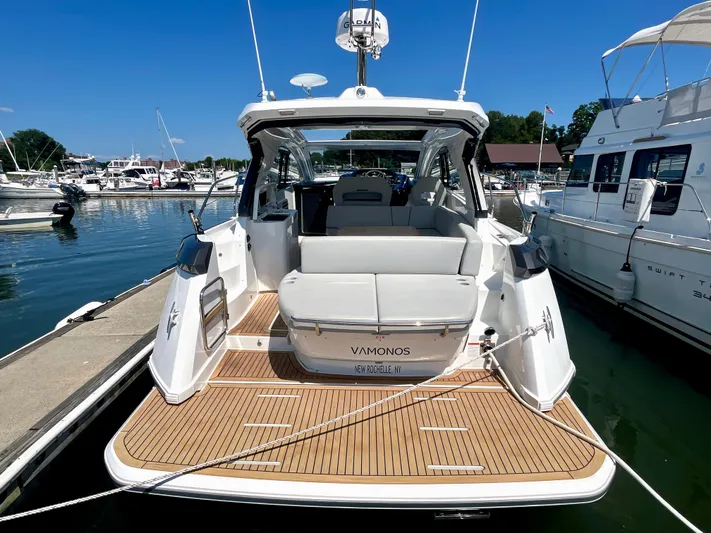 Vamanos Yacht Photos Pics 2023 Beneteau Gran Turismo 41 yacht docked at marina, rear view.