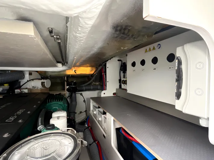 Vamanos Yacht Photos Pics Engine room of 2023 Beneteau Gran Turismo 41, showcasing mechanical components and wiring.