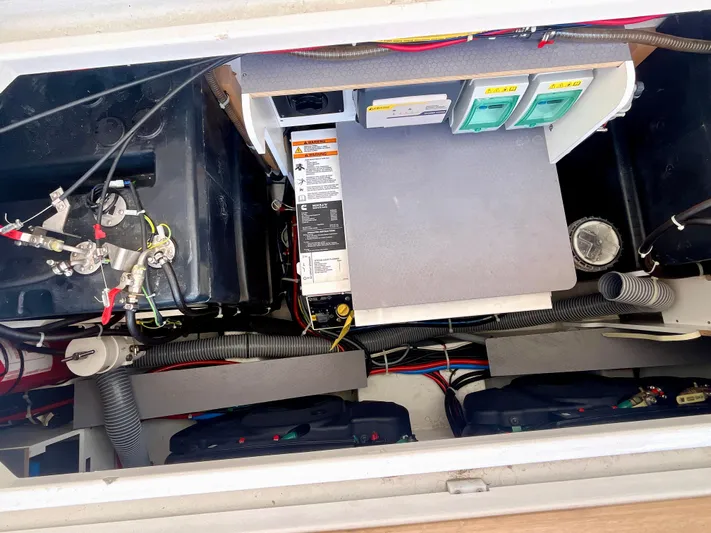 Vamanos Yacht Photos Pics Engine compartment of 2023 Beneteau Gran Turismo 41, showcasing wiring and components.