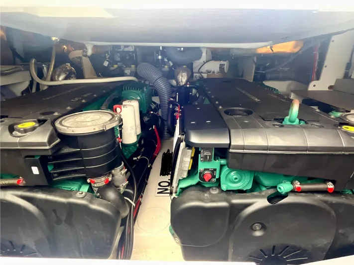 Vamanos Yacht Photos Pics Engine room of 2023 Beneteau Gran Turismo 41, showcasing dual engines and mechanical components.