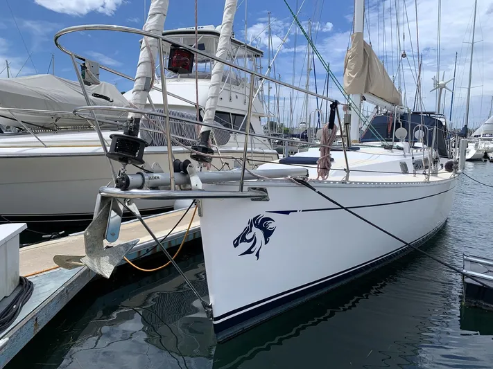 Wild Horses Yacht Photos Pics Saga 43 sailboat from 2002 docked at a marina, featuring a sleek design.