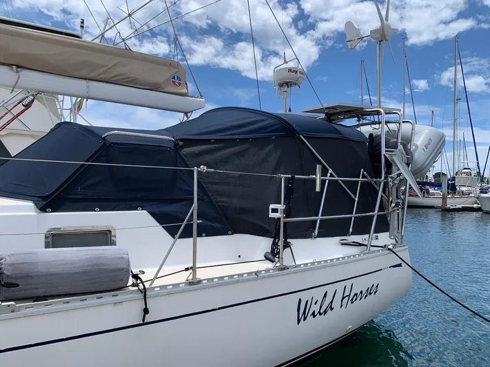 Wild Horses Yacht Photos Pics Saga 43 sailboat from 2002 named "Wild Horse" docked in a marina.