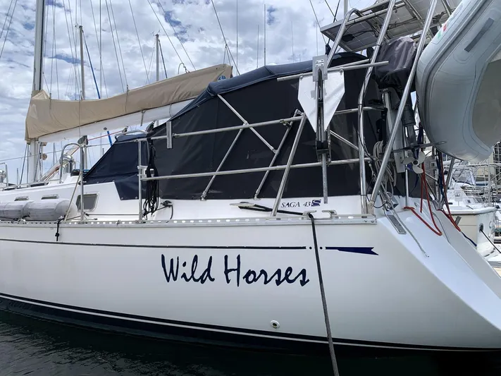 Wild Horses Yacht Photos Pics Saga 43 sailboat named "Wild Horses" docked at a marina, 2002 model.