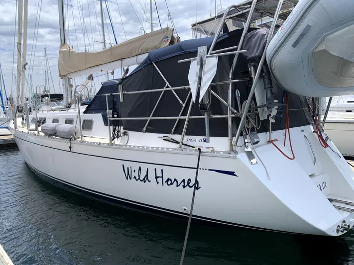 Wild Horses Yacht Photos Pics Saga 43 sailboat from 2002 named "Wild Horses" docked at a marina.