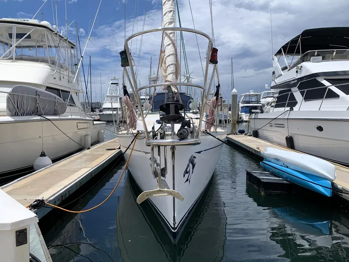 Wild Horses Yacht Photos Pics Sailboat docked in marina, Saga 43 model, 2002, surrounded by other boats.
