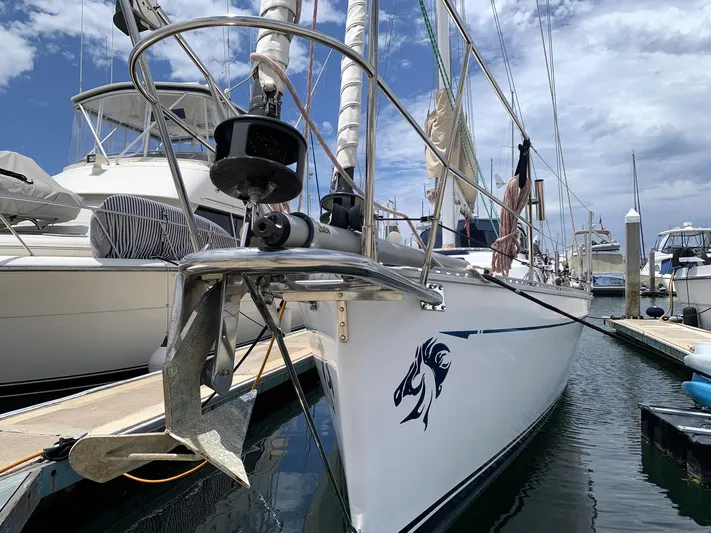 Wild Horses Yacht Photos Pics Sailboat docked in marina, Saga 43 model, 2002, with anchor and nautical design.