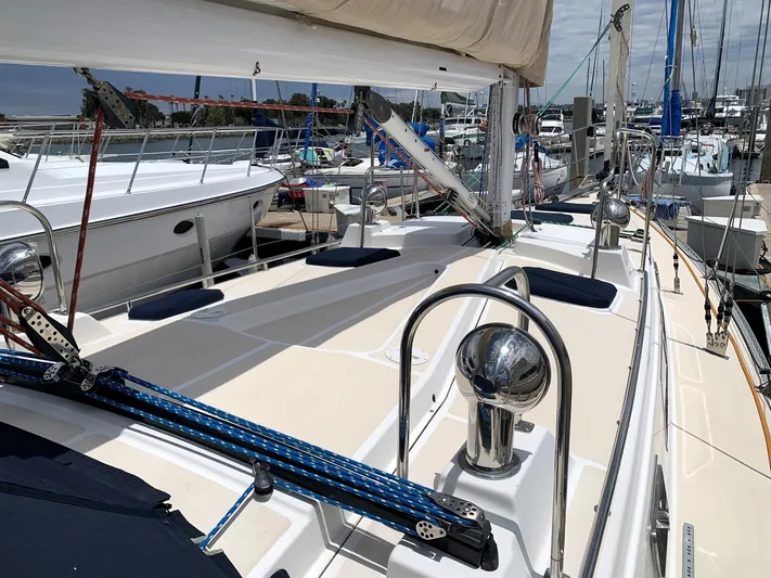 Wild Horses Yacht Photos Pics 2002 Saga 43 sailboat deck view in marina, showcasing rigging and polished fittings.