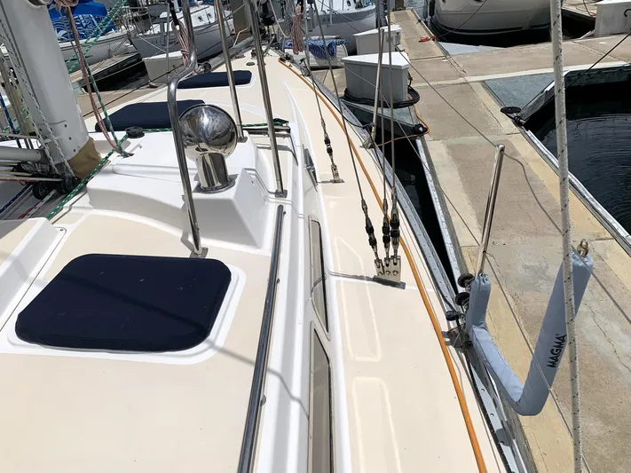 Wild Horses Yacht Photos Pics 2002 Saga 43 sailboat deck view at marina, showcasing rigging and fittings.