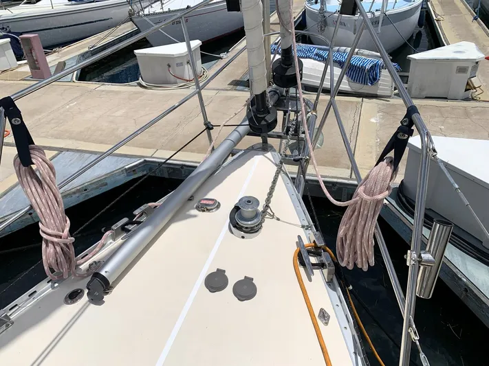 Wild Horses Yacht Photos Pics Deck of 2002 Saga 43 sailboat at marina, featuring ropes and winch.