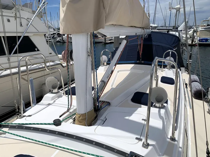 Wild Horses Yacht Photos Pics Sailboat deck of 2002 Saga 43, featuring sleek design and marina backdrop.