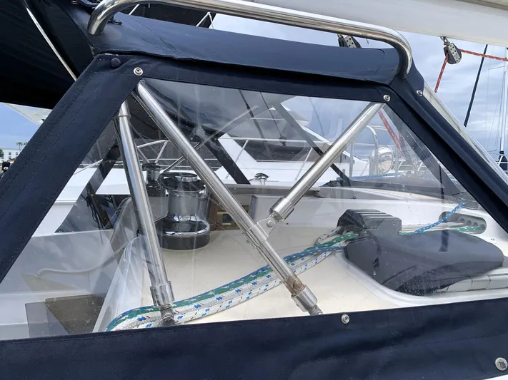 Wild Horses Yacht Photos Pics Cockpit of 2002 Saga 43 sailboat with protective cover and visible winch.