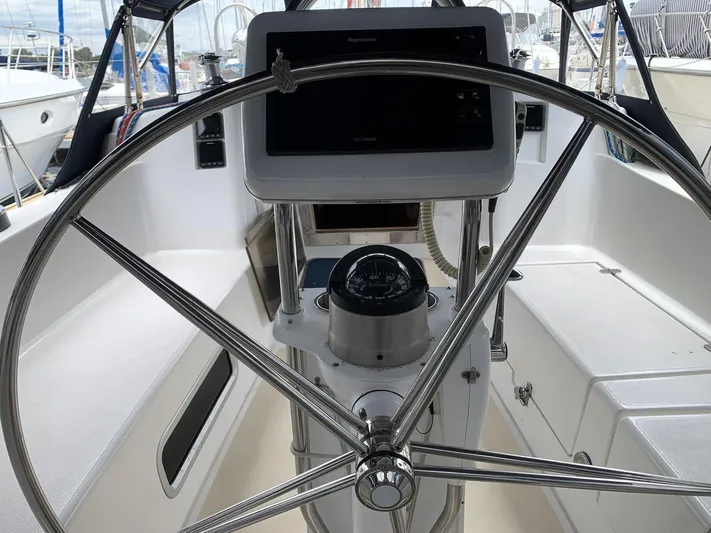 Wild Horses Yacht Photos Pics Steering wheel and navigation equipment on a 2002 Saga 43 sailboat.