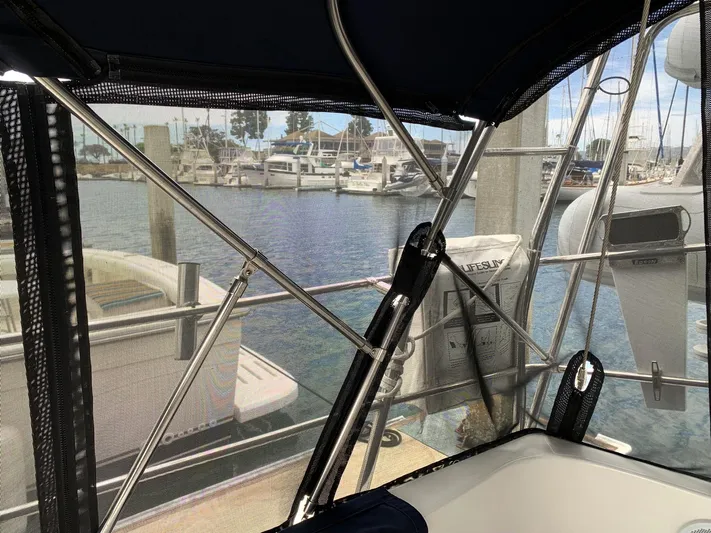 Wild Horses Yacht Photos Pics View from a 2002 Saga 43 sailboat cockpit, overlooking a marina with docked boats.