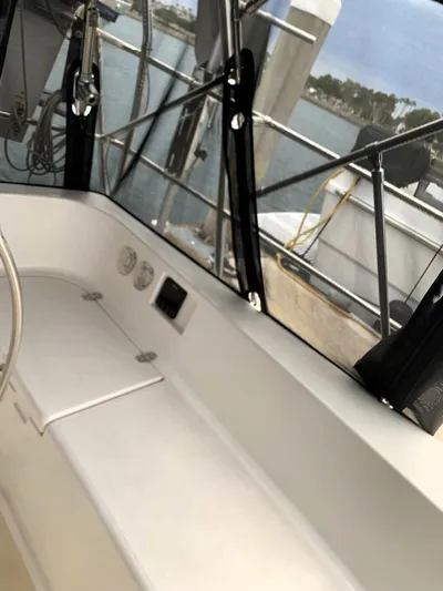 Wild Horses Yacht Photos Pics Interior view of 2002 Saga 43 sailboat cockpit with seating and windows.