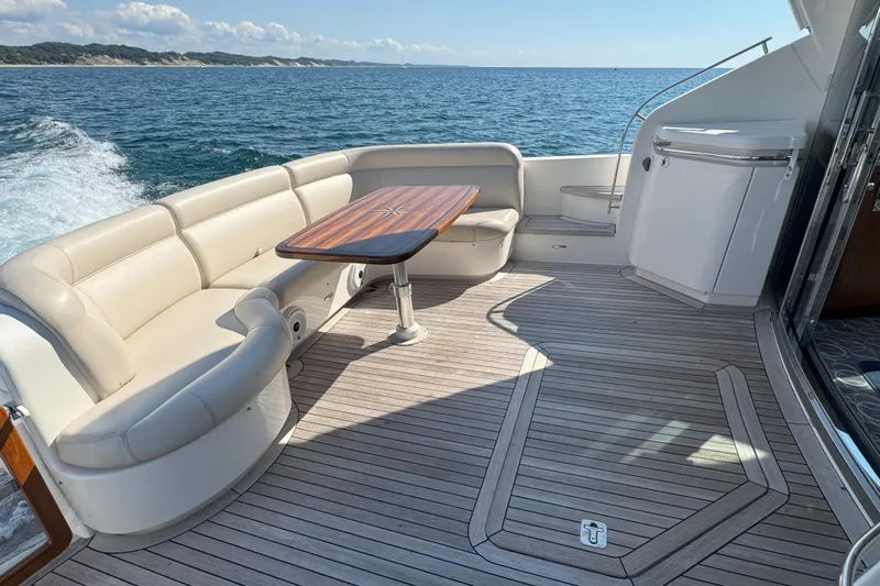 Yacht Photos Pics Luxurious 2014 Tiara Yachts 5800 Sovran deck with elegant seating and ocean view.