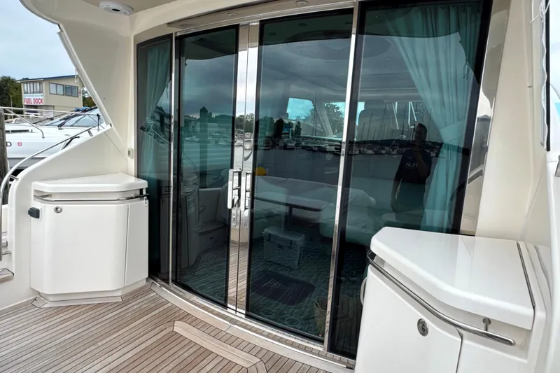  Yacht Photos Pics 2014 Tiara Yachts 5800 Sovran with sliding glass doors and teak deck.