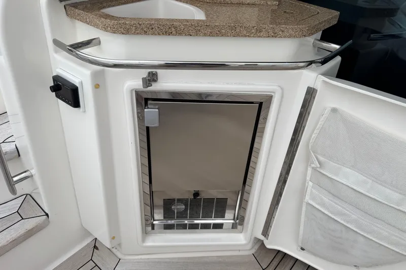  Yacht Photos Pics 2014 Tiara Yachts 5800 Sovran yacht kitchenette with mini fridge and countertop.