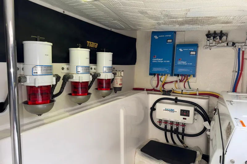  Yacht Photos Pics Engine room of 2014 Tiara Yachts 5800 Sovran with fuel filters and battery chargers.