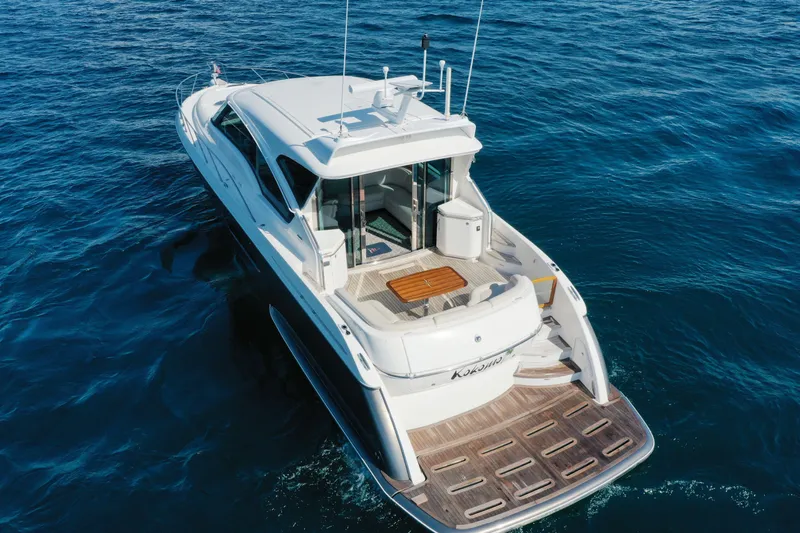  Yacht Photos Pics 2014 Tiara Yachts 5800 Sovran cruising on open water, showcasing sleek design and spacious deck.