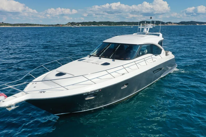  Yacht Photos Pics 2014 Tiara Yachts 5800 Sovran cruising on open water under a clear sky.
