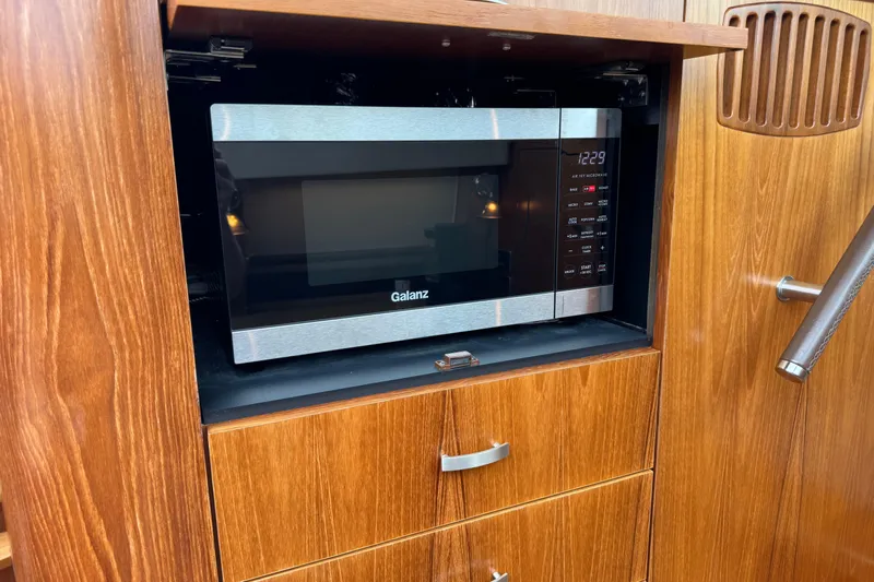  Yacht Photos Pics Galanz microwave in wooden cabinet on 2014 Tiara Yachts 5800 Sovran.