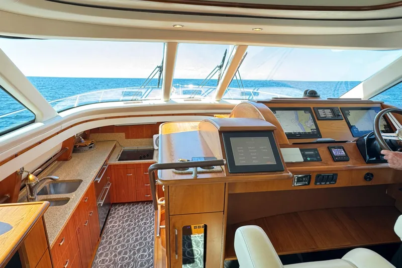  Yacht Photos Pics Luxurious interior of 2014 Tiara Yachts 5800 Sovran with modern navigation equipment.