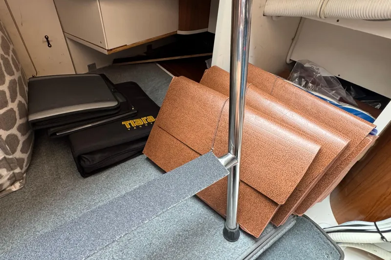  Yacht Photos Pics Interior of 2014 Tiara Yachts 5800 Sovran with folders and documents on carpeted floor.