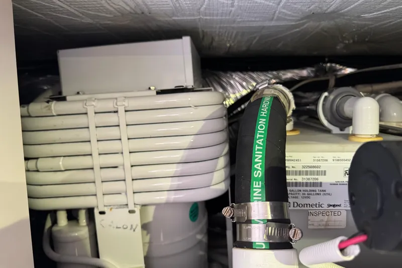  Yacht Photos Pics Engine room of 2014 Tiara Yachts 5800 Sovran, featuring marine sanitation hardware.