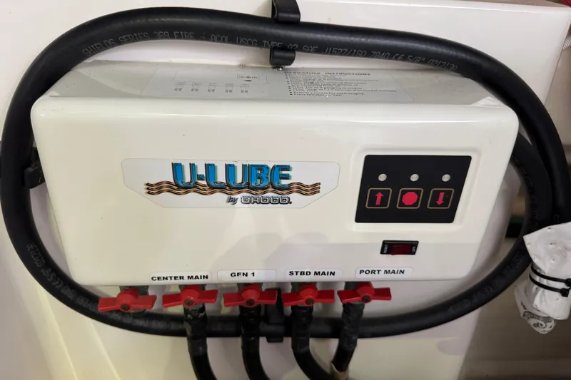  Yacht Photos Pics U-Lube system on 2014 Tiara Yachts 5800 Sovran, featuring control panel and labeled valves.