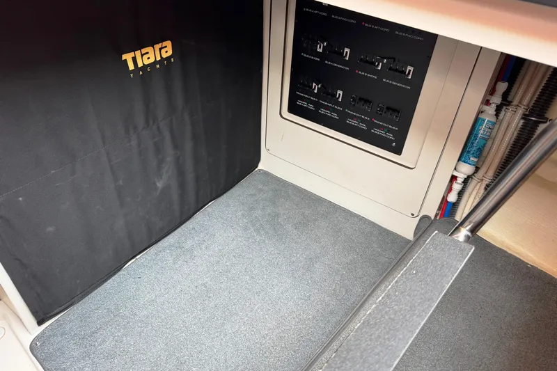  Yacht Photos Pics Interior view of 2014 Tiara Yachts 5800 Sovran, featuring control panel and carpeted flooring.