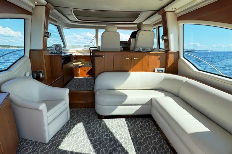  Yacht Photos Pics Luxurious interior of 2014 Tiara Yachts 5800 Sovran with elegant seating and ocean view.
