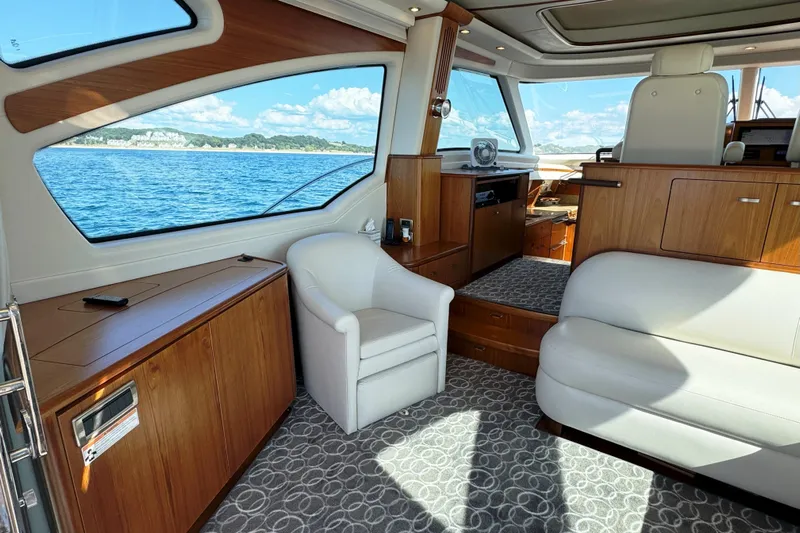  Yacht Photos Pics Luxurious interior of 2014 Tiara Yachts 5800 Sovran with elegant seating and scenic ocean view.
