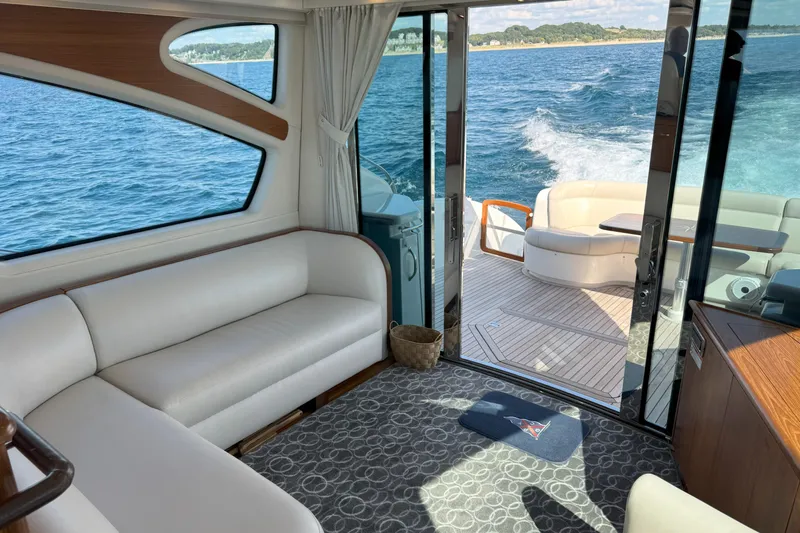 Yacht Photos Pics Luxurious interior of 2014 Tiara Yachts 5800 Sovran with ocean view and elegant seating.