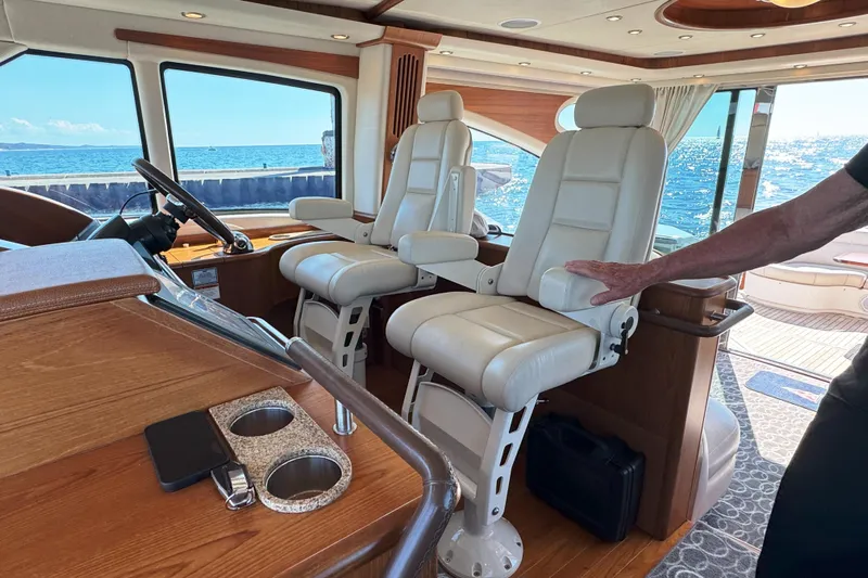  Yacht Photos Pics Luxurious interior of 2014 Tiara Yachts 5800 Sovran with plush seating and ocean view.