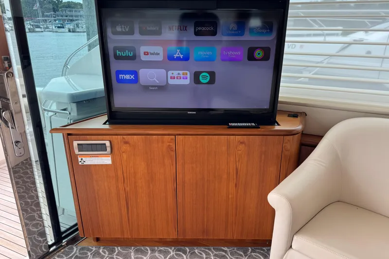  Yacht Photos Pics 2014 Tiara Yachts 5800 Sovran interior with TV and streaming apps on display.