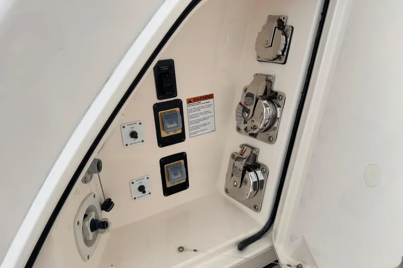  Yacht Photos Pics Control panel on a 2014 Tiara Yachts 5800 Sovran, featuring switches and connectors.