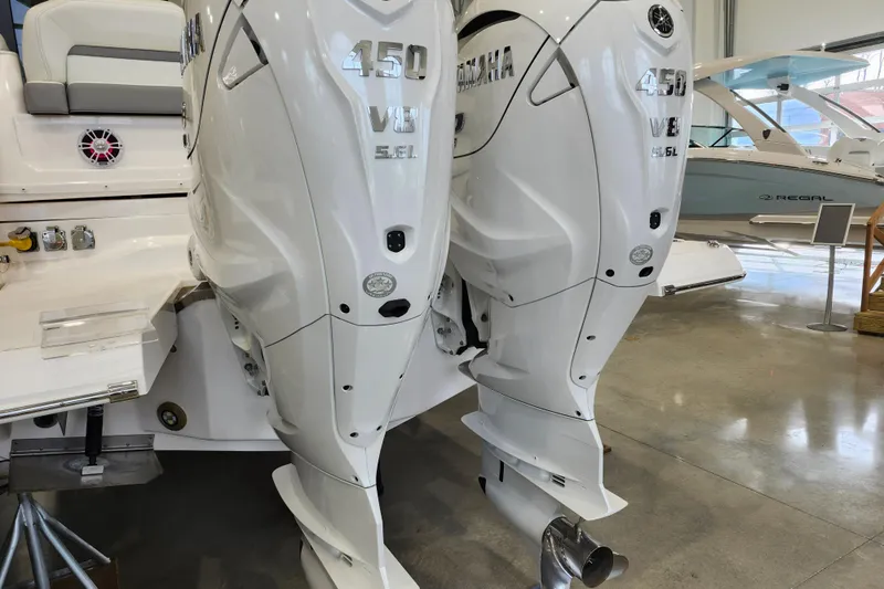  Yacht Photos Pics 2025 Regal 36 XO boat with twin Yamaha 450 V8 outboard engines in showroom.