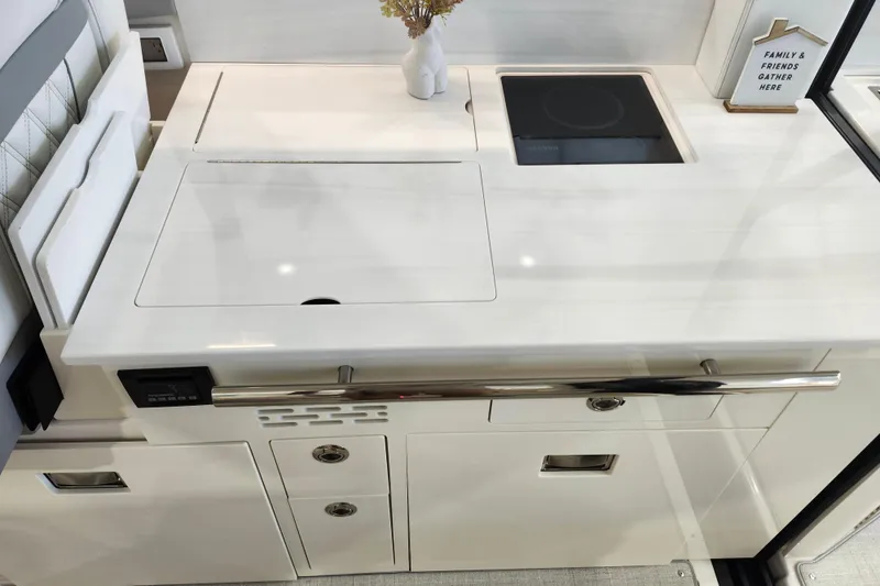  Yacht Photos Pics Modern kitchen area in 2025 Regal 36 XO yacht, featuring sleek design and induction cooktop.