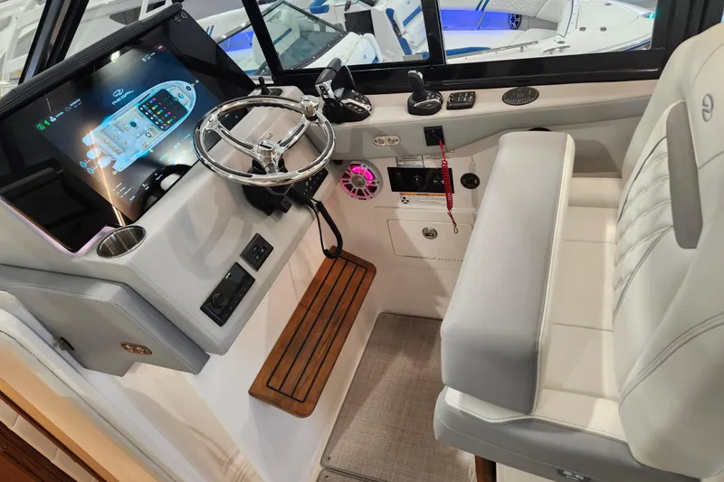 Yacht Photos Pics 2025 Regal 36 XO boat helm with modern controls and plush seating.