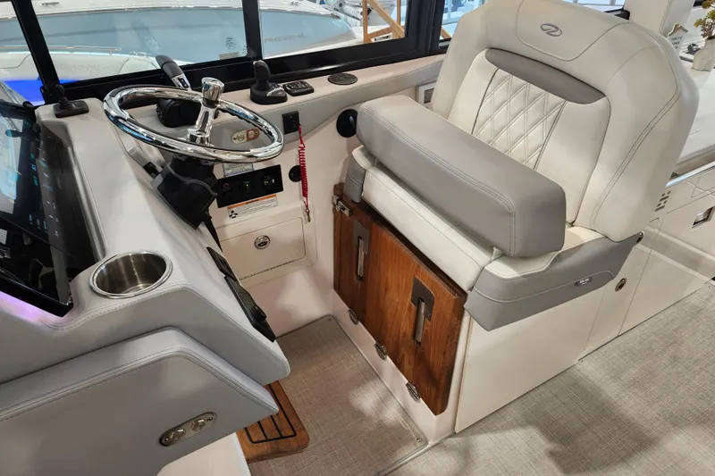  Yacht Photos Pics Luxury helm of 2025 Regal 36 XO boat with plush seating and modern controls.