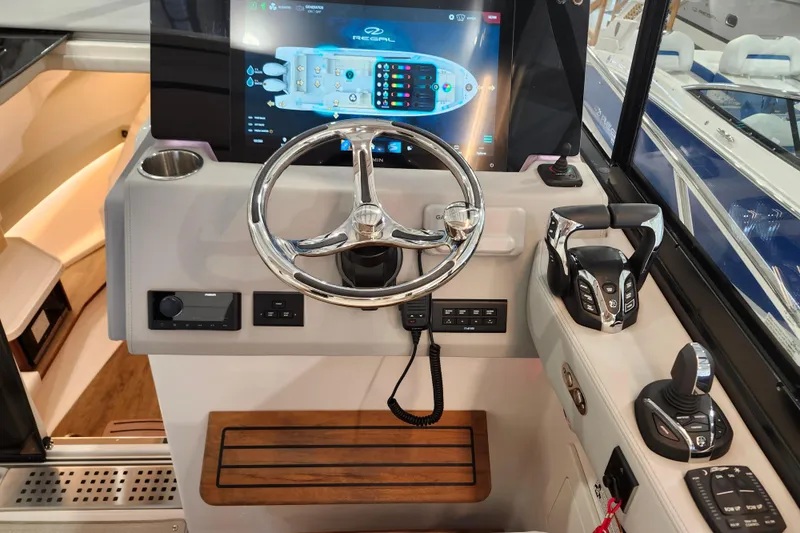  Yacht Photos Pics 2025 Regal 36 XO boat helm with modern controls and touchscreen display.