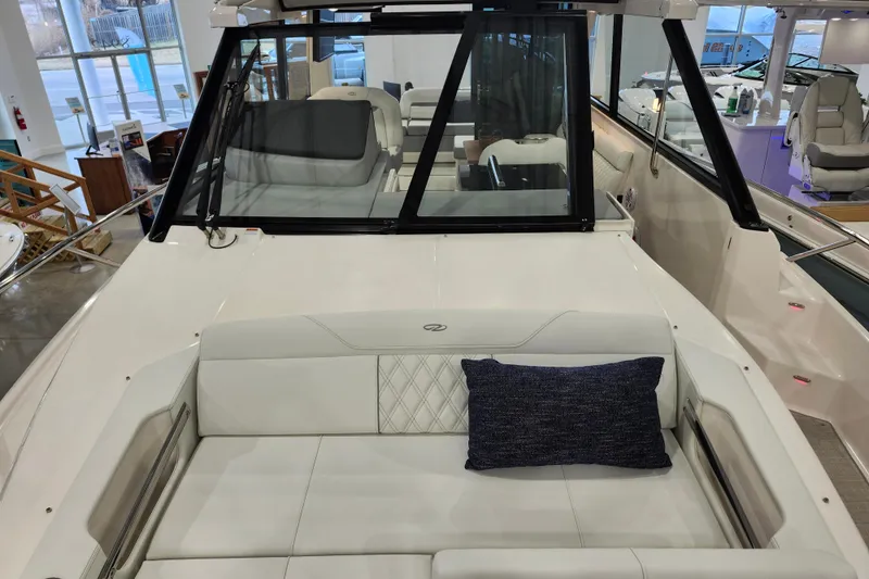  Yacht Photos Pics 2025 Regal 36 XO boat interior with white seating and blue cushion.